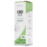 eine schachtel cbd-öl, die auf einem tisch steht.