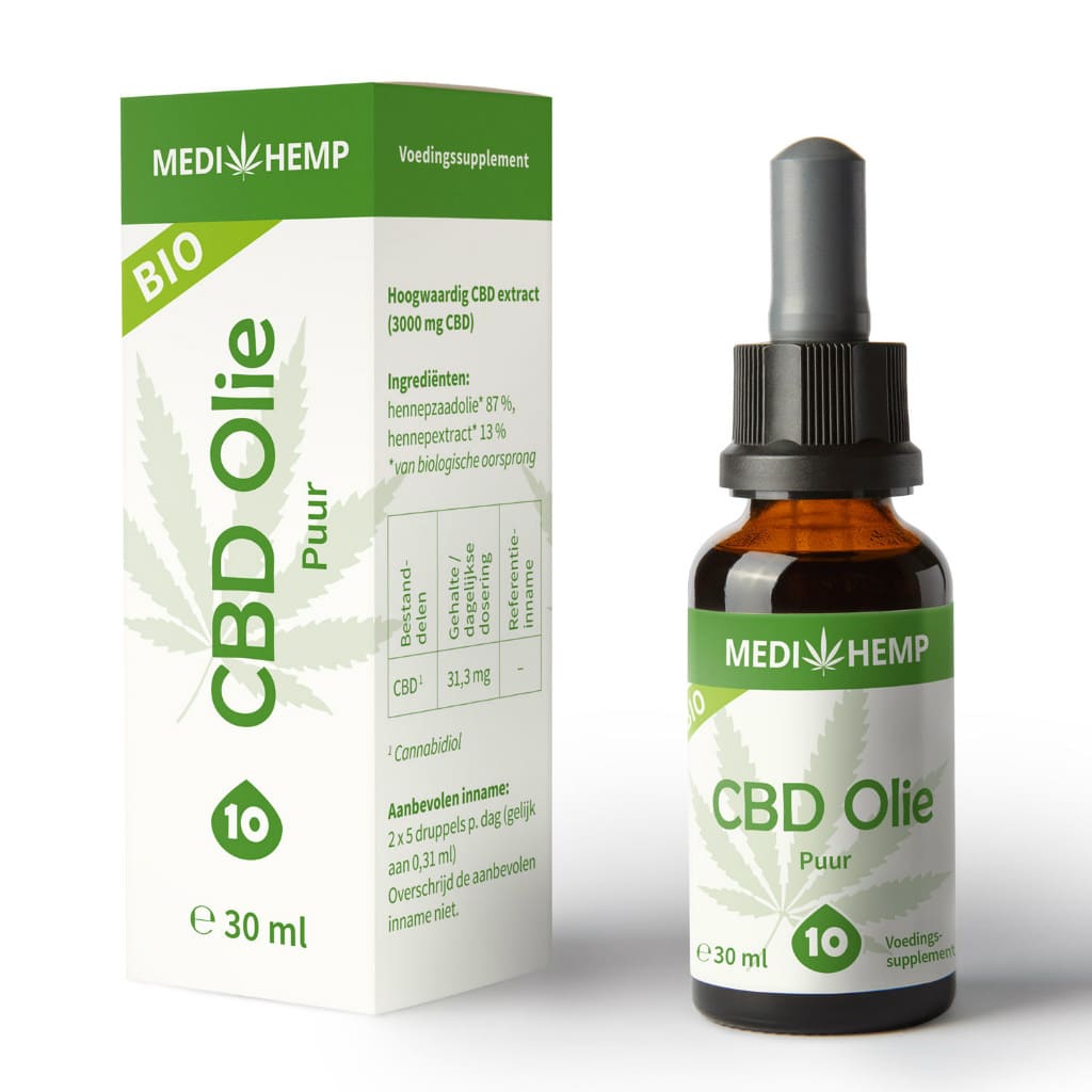 eine flasche cbd-öl neben einer schachtel.